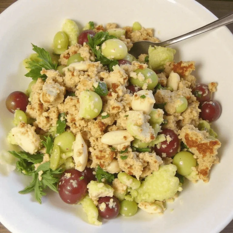 Chicken Salad Chick Grape Salad served in a bowl with fresh grapes and pecans